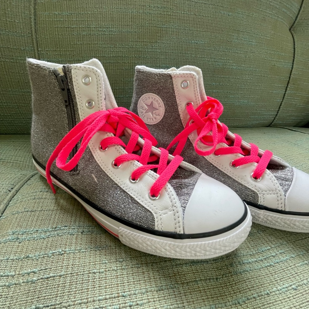 Silver sparkly converse sneakers with hot pink laces and zipper